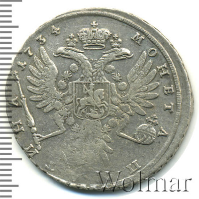 Полтина 1734 г. Анна Иоанновна. Лирический портрет. Корона разделяет круговую надпись (Полтина 1734г. Ag. RRR, Ильин - 10 рублей.)